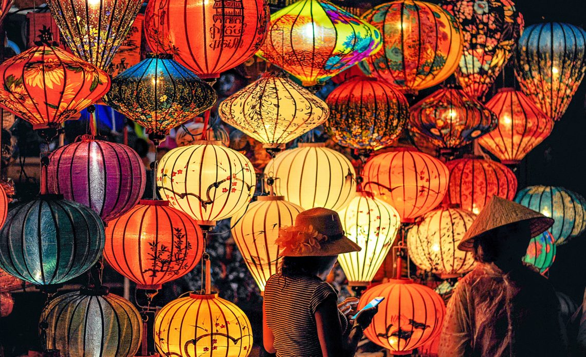 RadioMarocCulture Two Person Standing Near Assorted Color Paper Lanterns 1313814